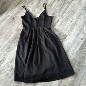 PLUNGING NECKLINE LITTLE BLACK DRESS